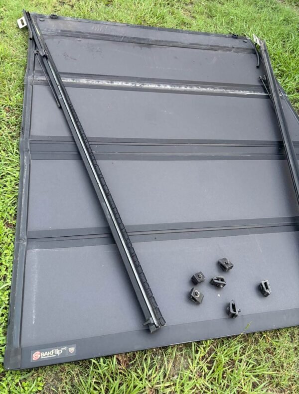 photo_2026-09-14_20-02-37 2019-2025 Chevy Silverado GMC Sierra 1500 6'7" Hard Folding Tonneau Bed Cover